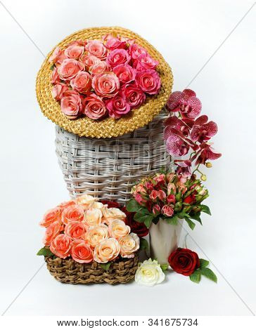 Roses. Colored rose. Holiday flower. Wedding decoration. Still life with roses and a white basket. Retro     