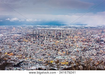 Sapporo, Japan aerial cityscape in winter at twilight.