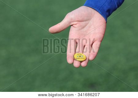 Makhachkala, Russia - March 9, 2019:  Football Referee Equipment, Uefa Yellow Coin Toss. Coin For Th