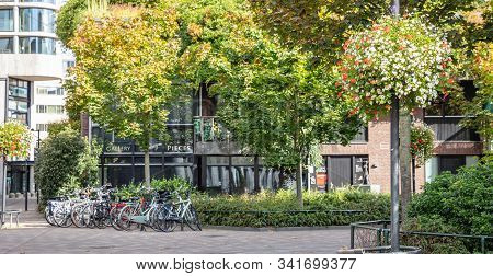 An Empty Paved Plaza Of The City Hosts Parked Bikes. Eindhoven, Netherlands.
