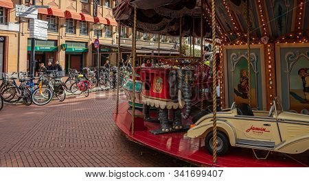 A Vintage Merry-go-round Game In A Paved Square. Eindhoven, Netherlands.