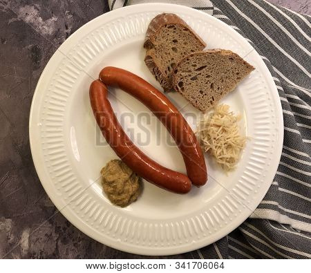 Debreziner Sausages With Mustard And Fresh Horseradish.