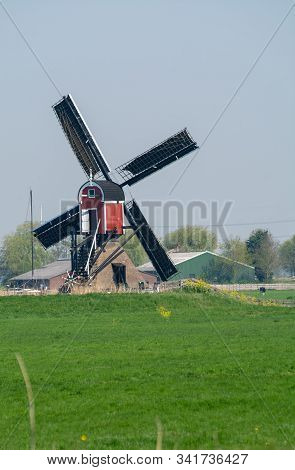 View On Traditional Dutch Wind Mill, Spring Landscape In North Holland