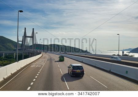 HONG KONG, CHINA - JUNE 18, 2015: view of the Kap Shui Mun Bridge seen from second desk of a double decker bus in Hong Kong in the daytime. 