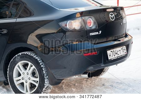 Novosibirsk, Russia - 12.26.2019: Black Mazda 3 2008 Year Rear View With Dark Gray Interior In Excel