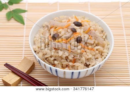 Closeup Of Japanese Food, Takikomi Gohan Boiled Rice On Bamboo Background