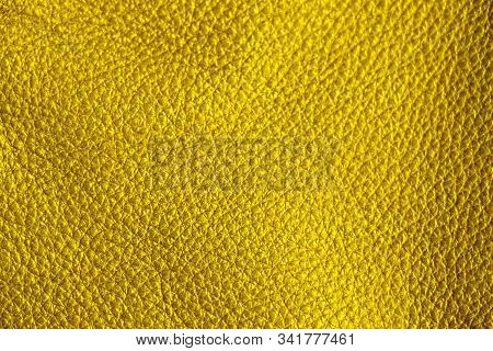 Texture Of Genuine Leather. Yellow Background. Golden Shade Material.