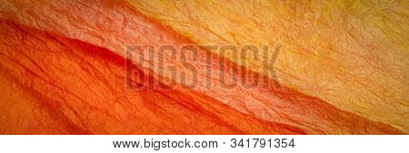 background of orange and red marbled momi paper, panoramic banner