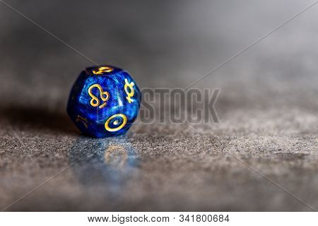 Blue Astrology Dice With Symbol Of Rahu On Dark Grey Background
