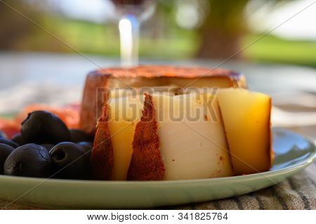 Tastes Of Spain, Jamon Iberian, Black Olives And Manchego Cheese With Red Paprika