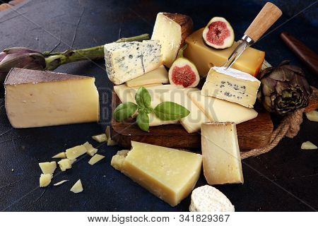 Different Sorts Of Cheese. Cheese Platter With Different Cheese And Spice