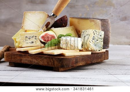 Different Sorts Of Cheese. Cheese Platter With Different Cheese And Spice