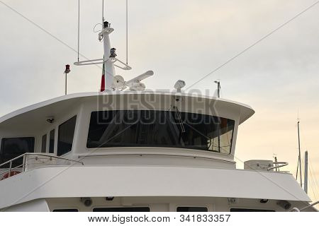 Detail Of White Ferry Cockpit In A Harbour
