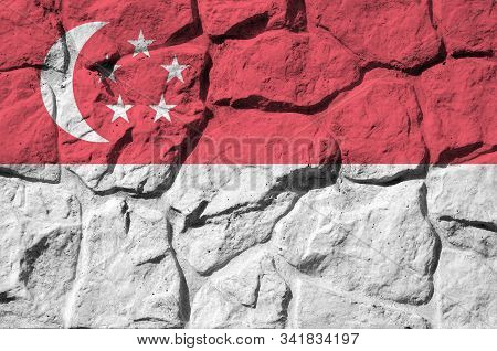 Singapore Flag Depicted In Paint Colors On Old Stone Wall Closeup. Textured Banner On Rock Wall Back
