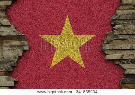 Vietnam Flag Depicted In Paint Colors On Old Stone Wall Closeup. Textured Banner On Rock Wall Backgr