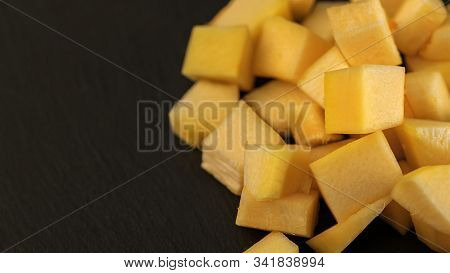 Fresh Pineapple Cube Slices On Black Background. Pineapple Chunks Close Up