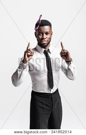 Portrait Of Happy Cheerful African Man In White Shirt Having Comb Stuck In His Hair Isolated Over Wh