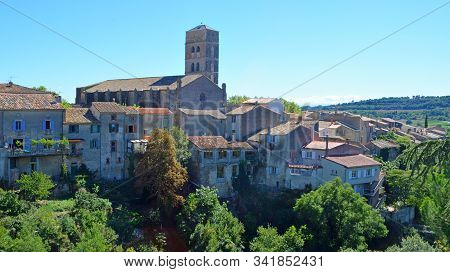 A View Of The Village Of Montolieu Aude  Languedoc - Roussillon  France. Trees Valley Ancient Houses