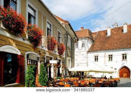 CLUJ NAPOCA, 26 SEPTEMBER 2019: A typical street view in the old center of Cluj Napoca, Romania                               