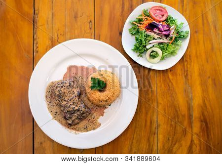 Steak Au Poivre Or Pepper Steak Served With Quinoa And A Fresh Salad
