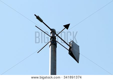 Vintage Retro Weather Vane Instrument Showing Wind Direction And Arrow Pointing Towards North Mounte