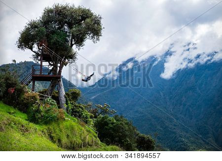 Tourist Swinging On The Swing Of The End Of The World (columpio Del Fin Del Mundo) In Baños, Ambato 