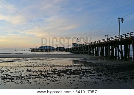 Santa Barbara, California - May 18, 2019: Stearns Wharf At Sunrise Under Colorful High Altitude Clou