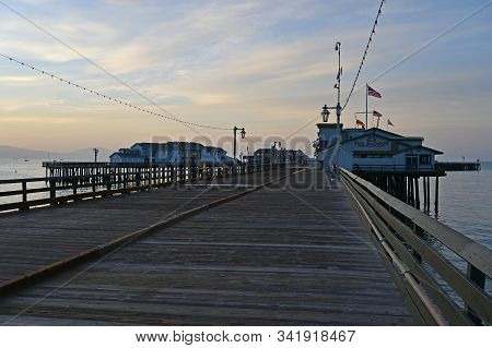 Santa Barbara, California - May 18, 2019: Stearns Wharf At Sunrise Under Colorful High Altitude Clou