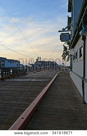 Santa Barbara, California - May 18, 2019: Stearns Wharf At Sunrise Under Colorful High Altitude Clou