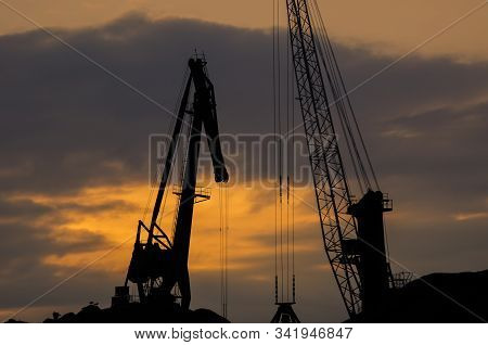 Port Cranes - Fiery Morning Over The Transhipment Terminal In The Seaport