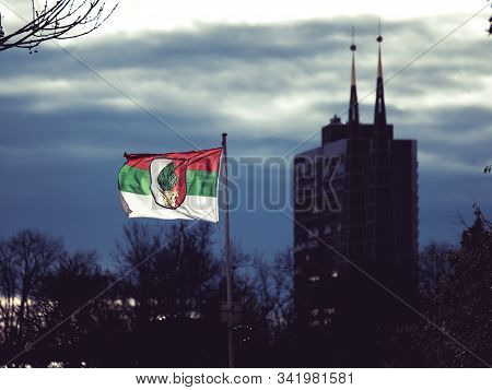 Augsburg, Germany - December 15, 2019: Illuminated Flag Of The Soccer Club Fc Augsburg Flatters In T
