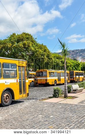 Funchal, Madeira, Portugal - Sep 10, 2019: Main Station Terminal With Yellow Buses In The Madeiran C