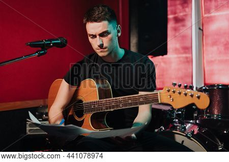Songwriter Thinking And Writing Notes, Lyrics On Sheets At Studio. Concept For Musician Creative, Ar