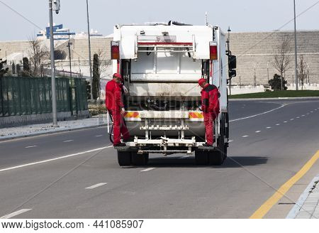Baku, Azerbaijan  06 April  2018 Garbage Collection Service, Rubbish Cleaner Man In A Uniform Workin