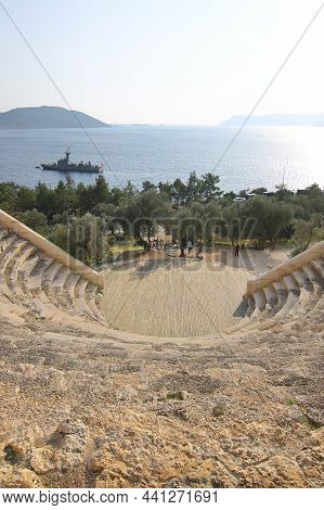 Kas, Turkey. 17 November 2021: The Theatre Of Antiphellos Ancient City In Kas, Antalya. Tourists Wal