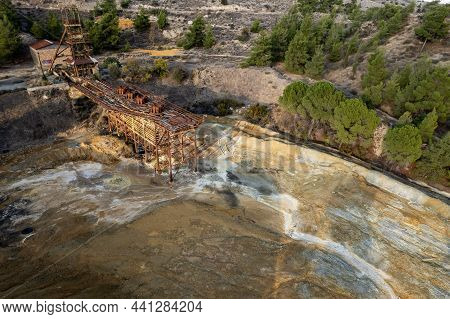 Aerial Drone View Of Abandoned Copper Mine Rusty Structure With Red Toxic Dry Sand. Environmental Po