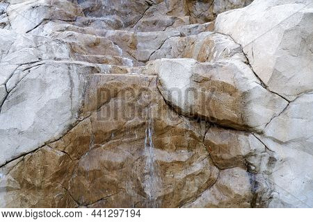 Water Flowing Down Large Stones Close Up