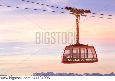 Chamonix Mont Blanc, France - January, 28, 2015: Cable Car Cabin At Aiguille Du Midi And Pink Sunset