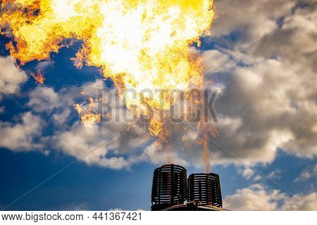 Fire Flame From A Balloons Aerostate Against A Cloudy Sky Before The Balloons Take Off. High Quality