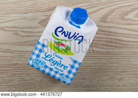 Primelin - France, November 27, 2019 : Box Of Liquid Cream Envia On Wooden Background