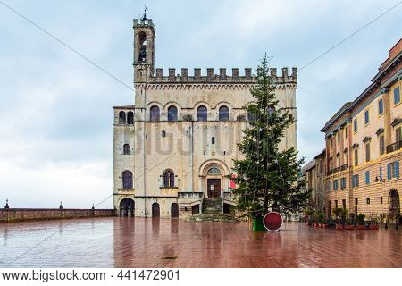 The antique city with a rich history and grandiose architecture. The city is located in the mountains of Umbria. Piazza Grande is the city center. Consular palace. Rainy day