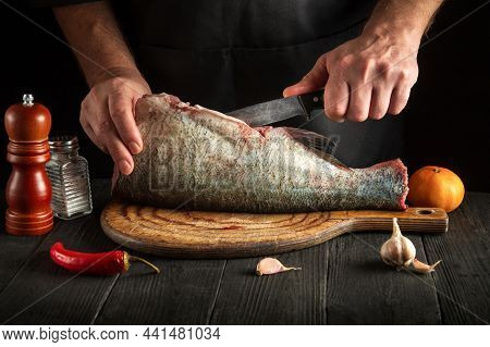 The Chef Cleaning Bighead Carp Fish. Working Environment In The Restaurant Kitchen. Fish Diet Concep