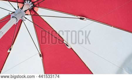 Umbrella Beach. Red Summer Beach Parasol On Blue Sea Background. Sun Sunshade For Vacation Travel. O