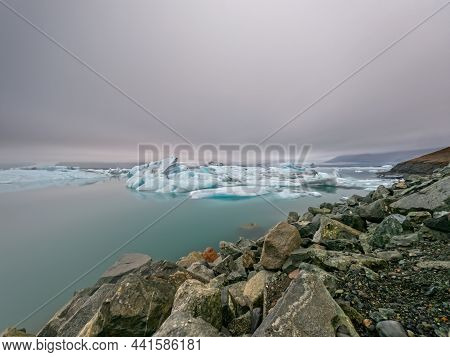 Ice Lagoon And Glacier Long Exposure, Cloudy Day In Jokusarlon