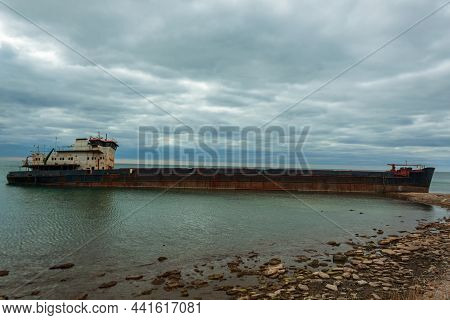 Shipwreck Of A Dry Cargo Ship Off The Coast Of The Taman Peninsula. An Abandoned Rusty Vessel On The