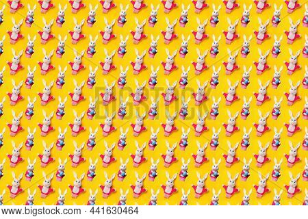 Seamless Pattern With Easter Bunny And Egg Isolated On Yellow Background. Funny Texture. Education T