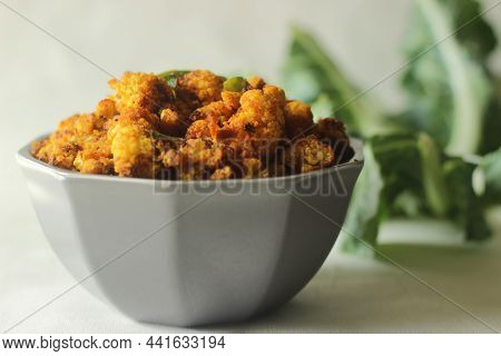 Air Fried Tandoori Cauliflower. Cauliflower Florets Marinated With Yogurt And Spices And Air Fried.