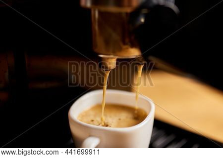 Detail Of A Professional Coffe Maker Dripping Coffe Into An Empty Cup In A Cafeteria