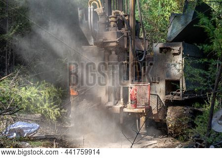 Crawler Drilling Rig Drills Well, Lot Of Dust When Drilling Borehole.