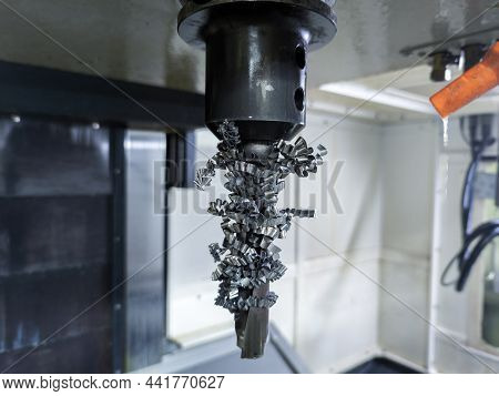 Large Indexing Carbide Drill Wrapped With Long Steel Swarf Stopped In Vertical Cnc Milling Machine